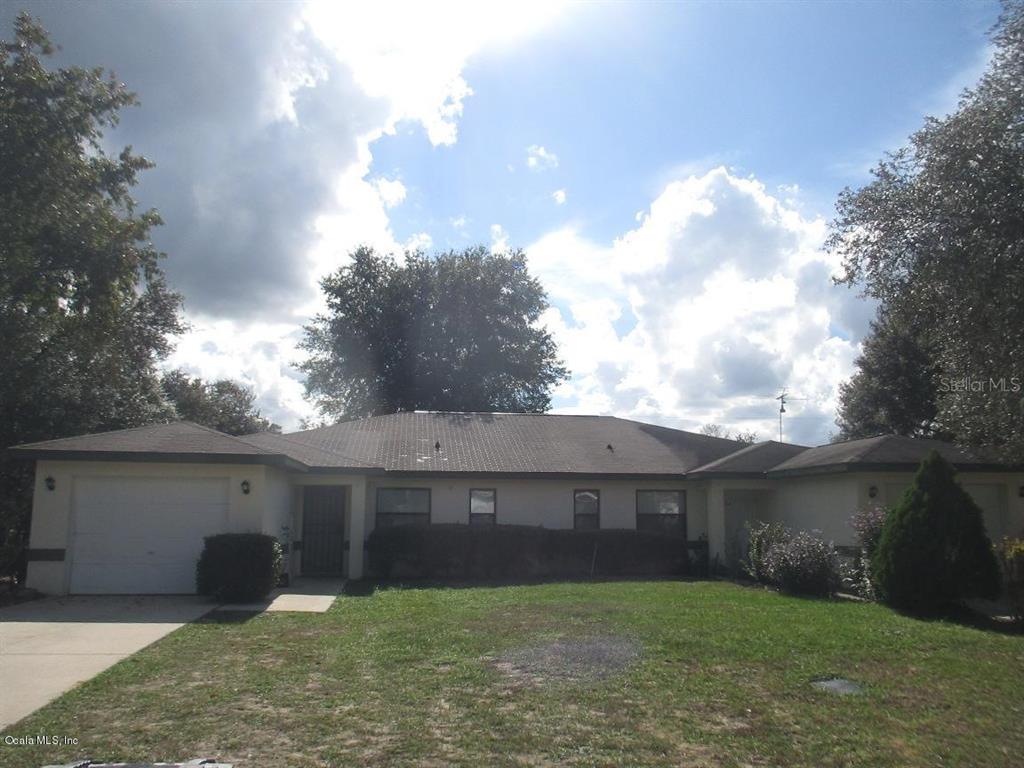 3510 Southwest 157th Loop Ocala, FL 34473 - Photo 1 of 1 a view of a yard in front of a house