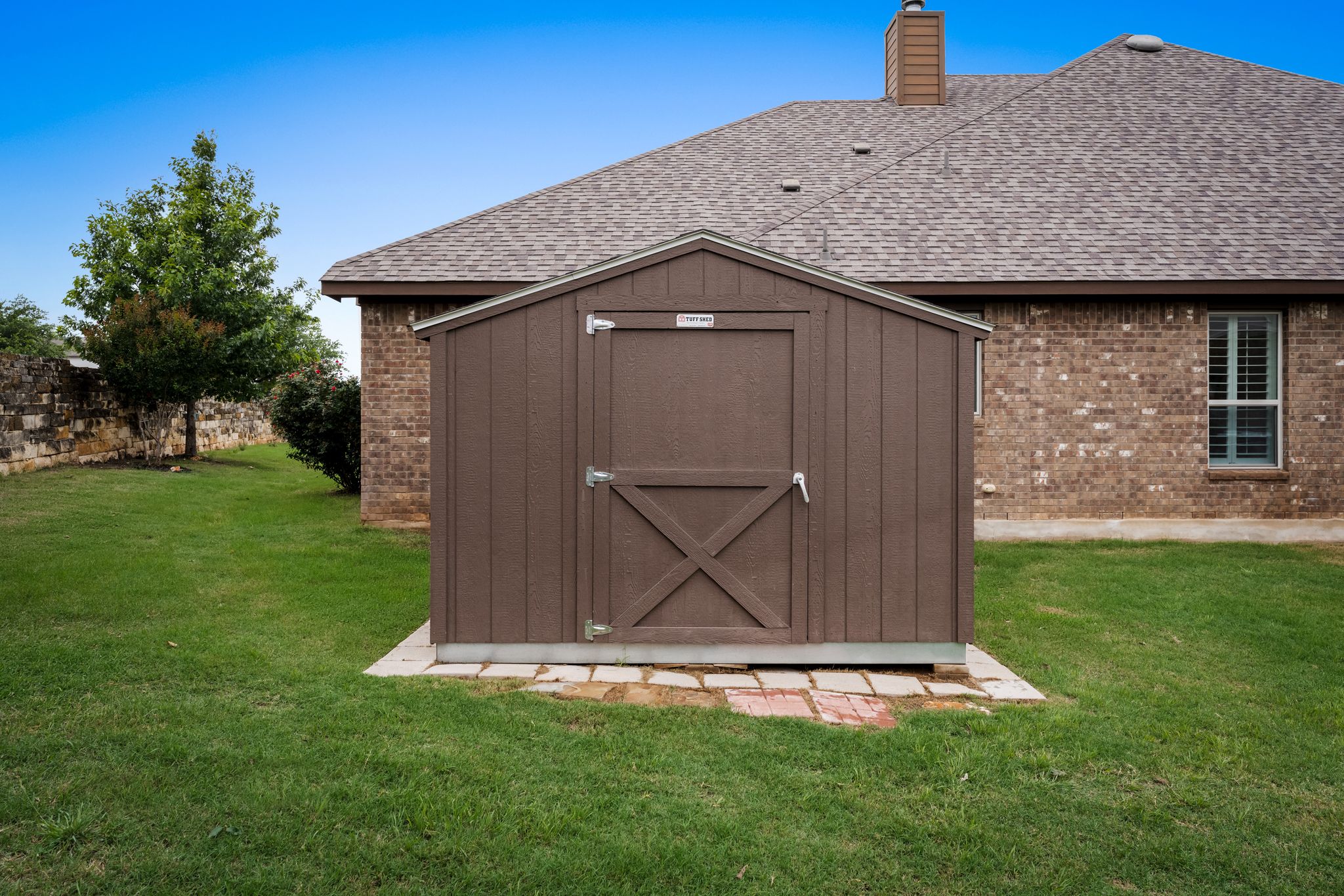 140 Waterloo Cove Georgetown, TX 78628 - Photo 32 of 40 A quaint storage shed with a rustic barn-style door stands ready to organize your outdoor essentials.