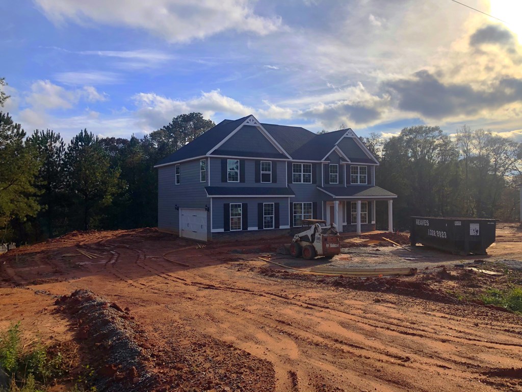 1935 Andrews Road Opelika, AL 36801 - Photo 2 of 3 a view of a big house with a big yard and large trees