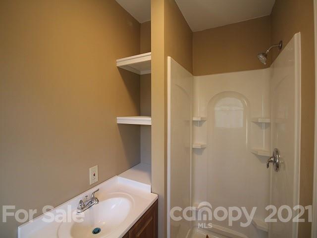166 Cemetery Street Chester, SC 29706 - Photo 17 of 28 a bathroom with a sink and a mirror