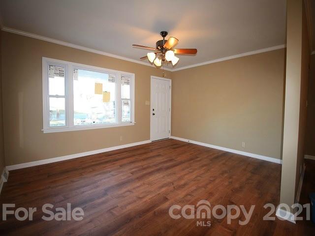 166 Cemetery Street Chester, SC 29706 - Photo 3 of 28 a view of an empty room with window and wooden floor