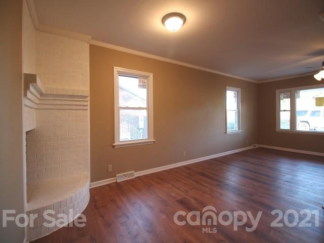 166 Cemetery Street Chester, SC 29706 - Photo 5 of 28 a view of an empty room with window and wooden floor