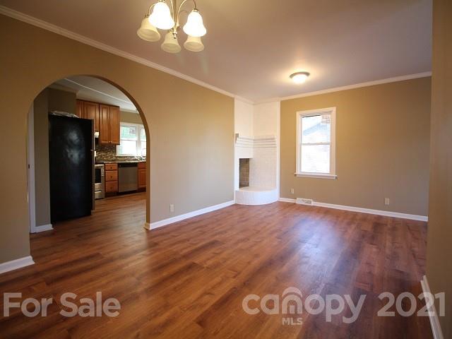 166 Cemetery Street Chester, SC 29706 - Photo 7 of 28 a view of empty room with window and wooden floor