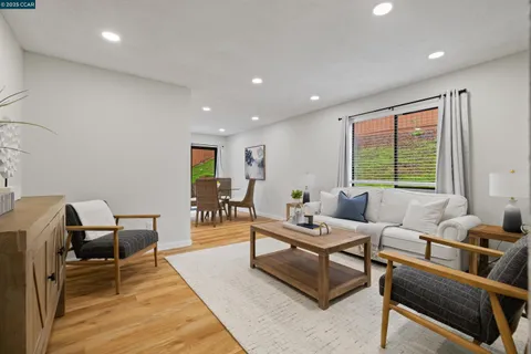 a living room with furniture and large window