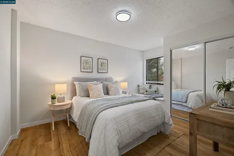 a bedroom with a bed and a mirror