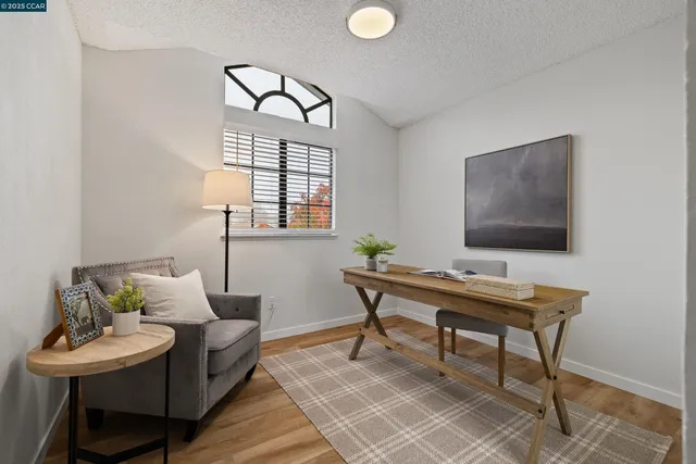 a work room with furniture and a window