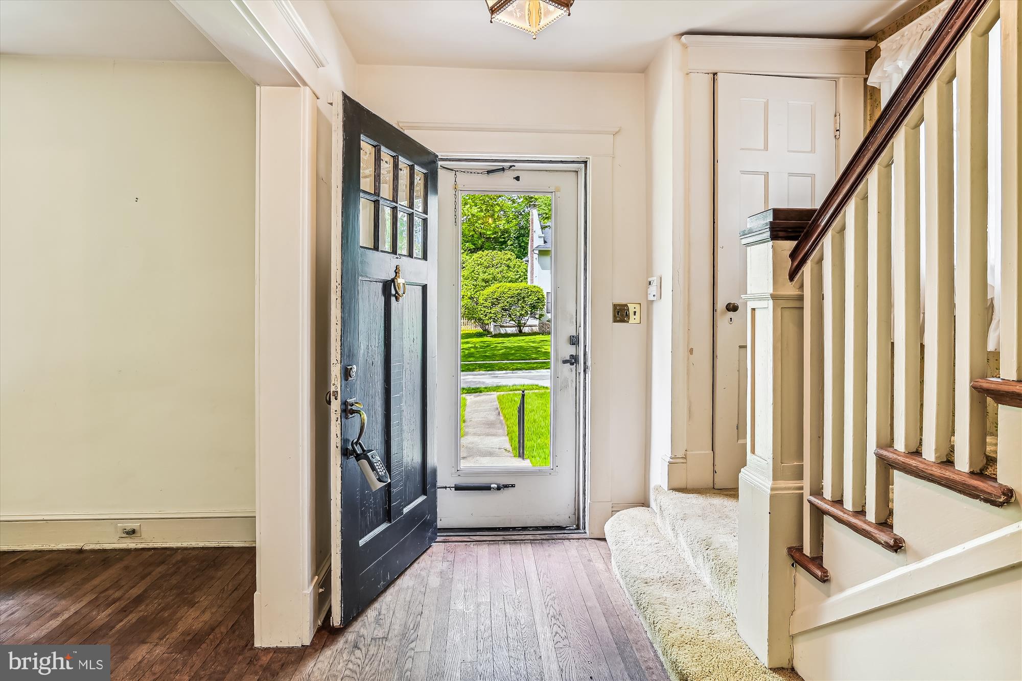 6211 Pinehurst Road Baltimore, MD 21212 - Photo 11 of 37 a view of an entryway with wooden floor and door