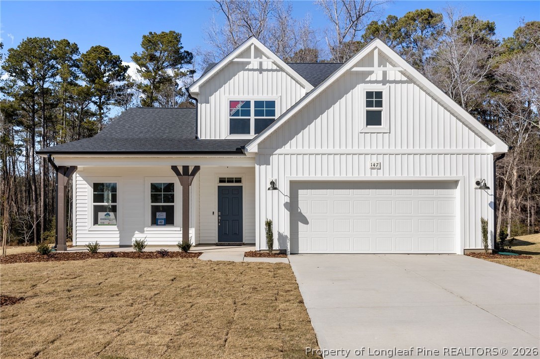 147 Michter Street Vass, NC 28394 - Photo 1 of 48 a view of a white house with a outdoor space