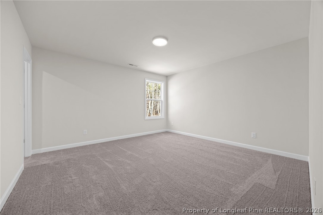 147 Michter Street Vass, NC 28394 - Photo 20 of 48 an empty room with windows