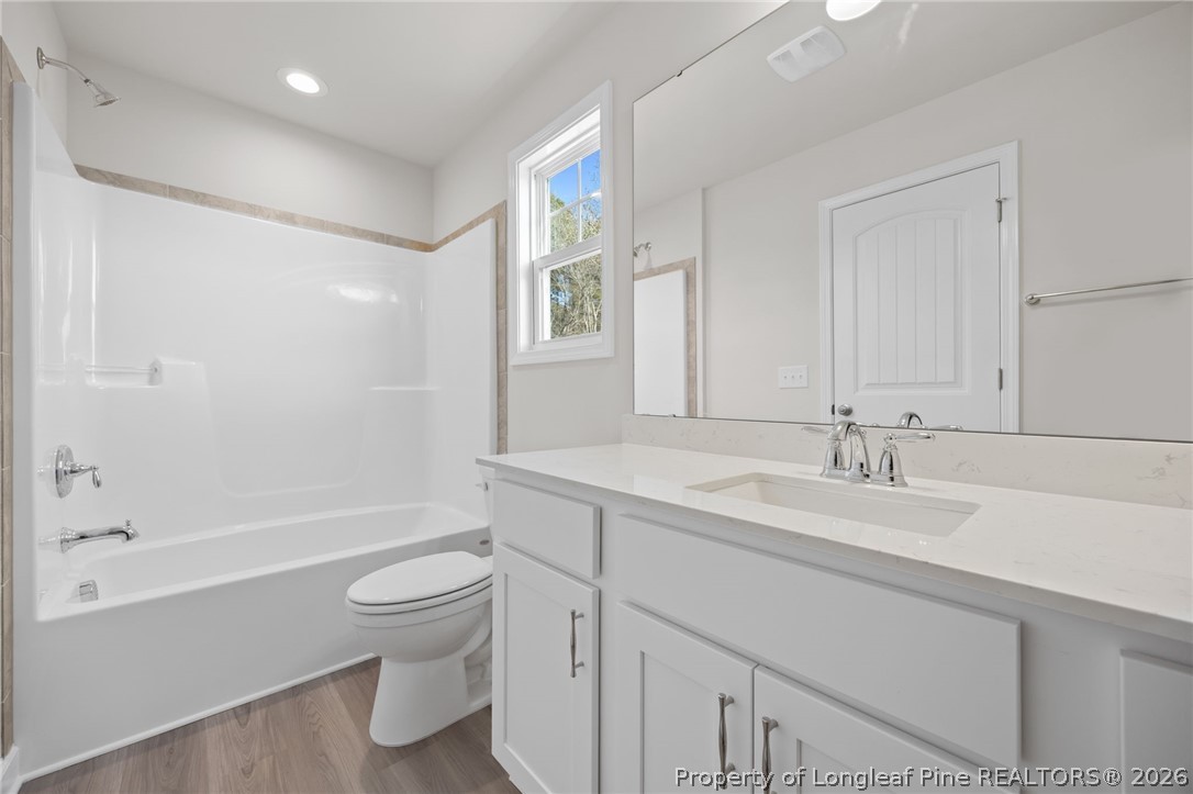 147 Michter Street Vass, NC 28394 - Photo 22 of 48 a bathroom with a sink a toilet and shower