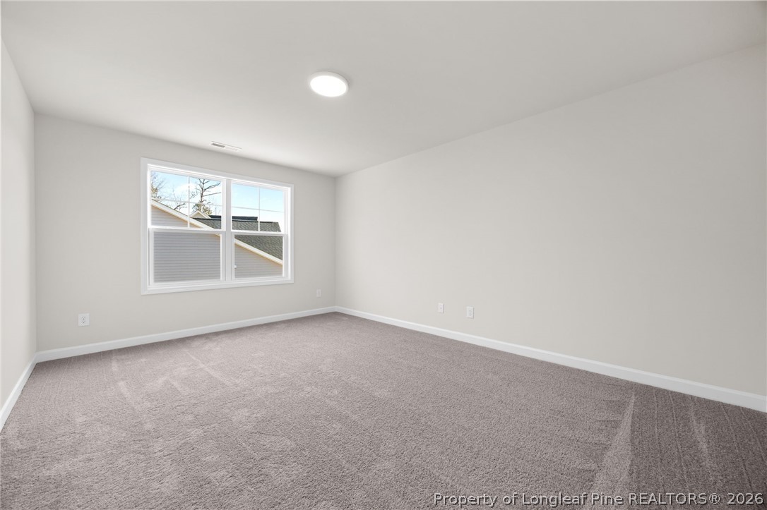 147 Michter Street Vass, NC 28394 - Photo 23 of 48 an empty room with windows and closet