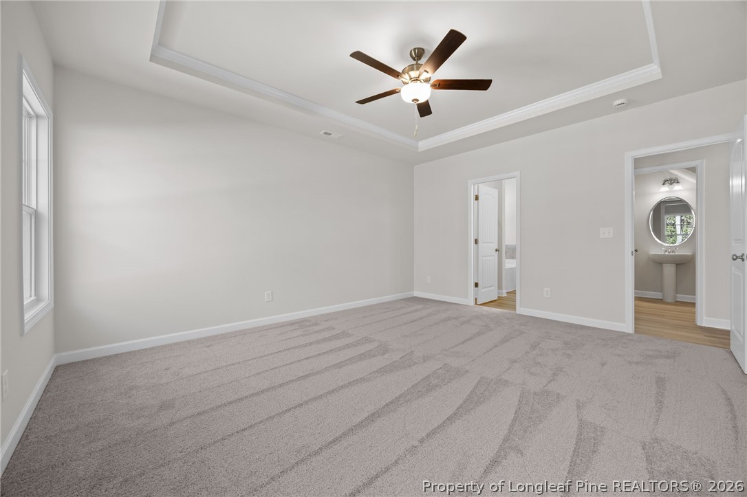 147 Michter Street Vass, NC 28394 - Photo 29 of 48 an empty room with windows and ceiling fan