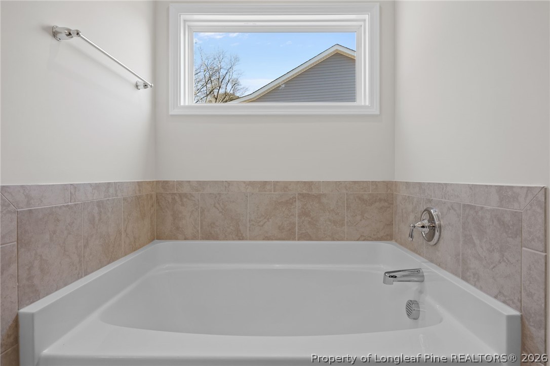 147 Michter Street Vass, NC 28394 - Photo 32 of 48 a bathroom with a bathtub