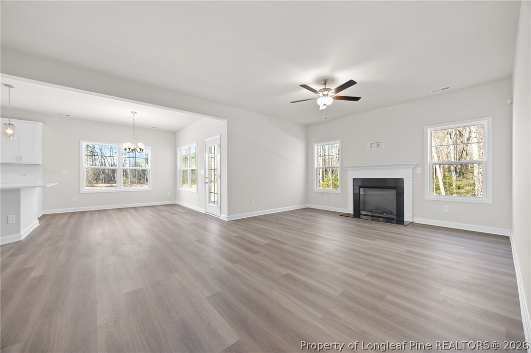 147 Michter Street Vass, NC 28394 - Photo 34 of 48 a view of an empty room with a fireplace and a window