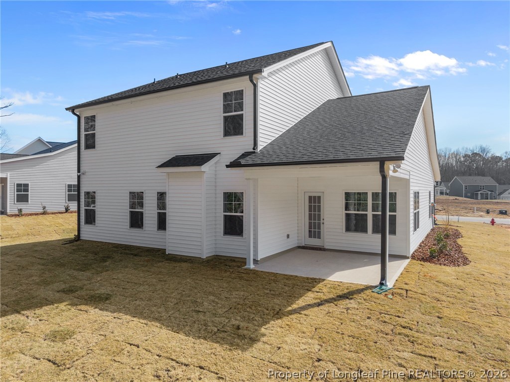 147 Michter Street Vass, NC 28394 - Photo 10 of 48 a view of a house with a yard