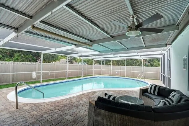 a view of swimming pool with outdoor seating