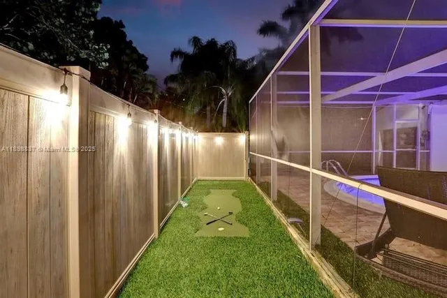 a view of swimming pool with a yard
