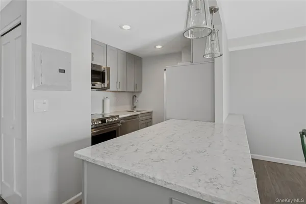 a view of a kitchen with a sink and a window