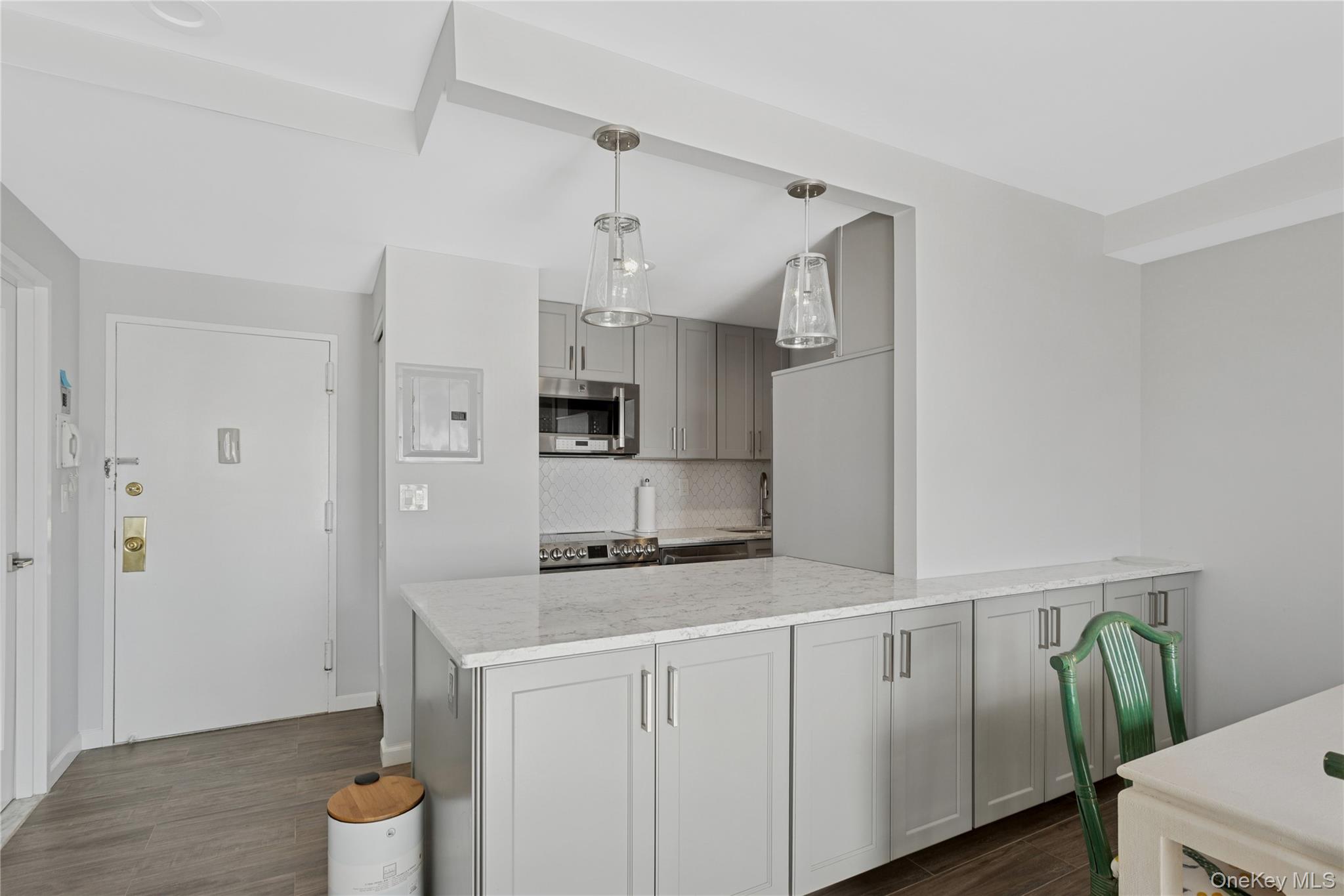 2 Richmond Road, Unit 3A Lido Beach, NY 11561 - Photo 15 of 33 a kitchen with stainless steel appliances a refrigerator and a stove top oven