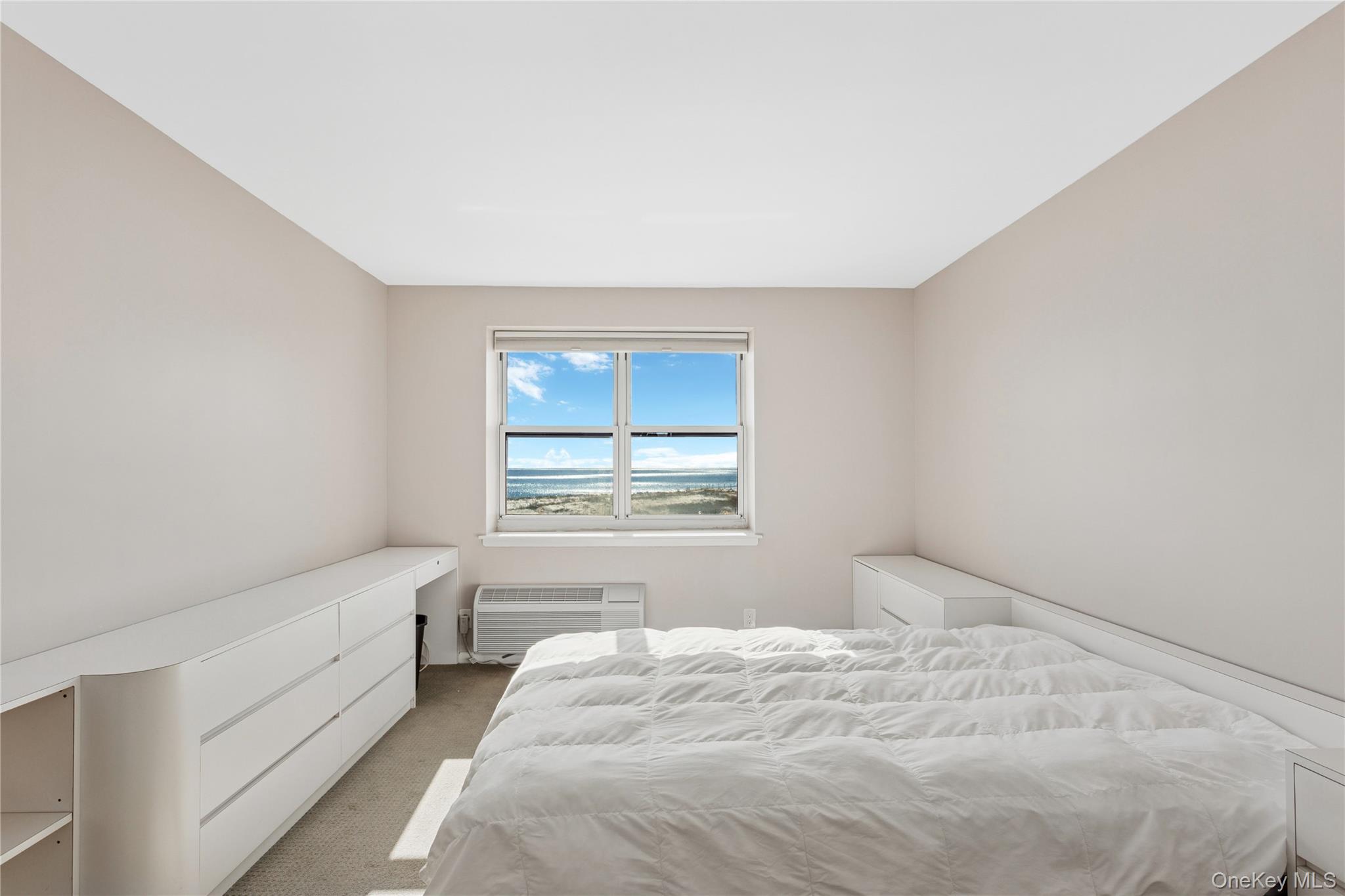 2 Richmond Road, Unit 3A Lido Beach, NY 11561 - Photo 18 of 33 a bedroom with a bed and a window