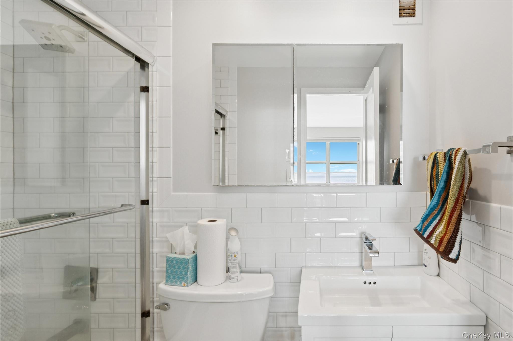 2 Richmond Road, Unit 3A Lido Beach, NY 11561 - Photo 21 of 33 a bathroom with a sink and a mirror