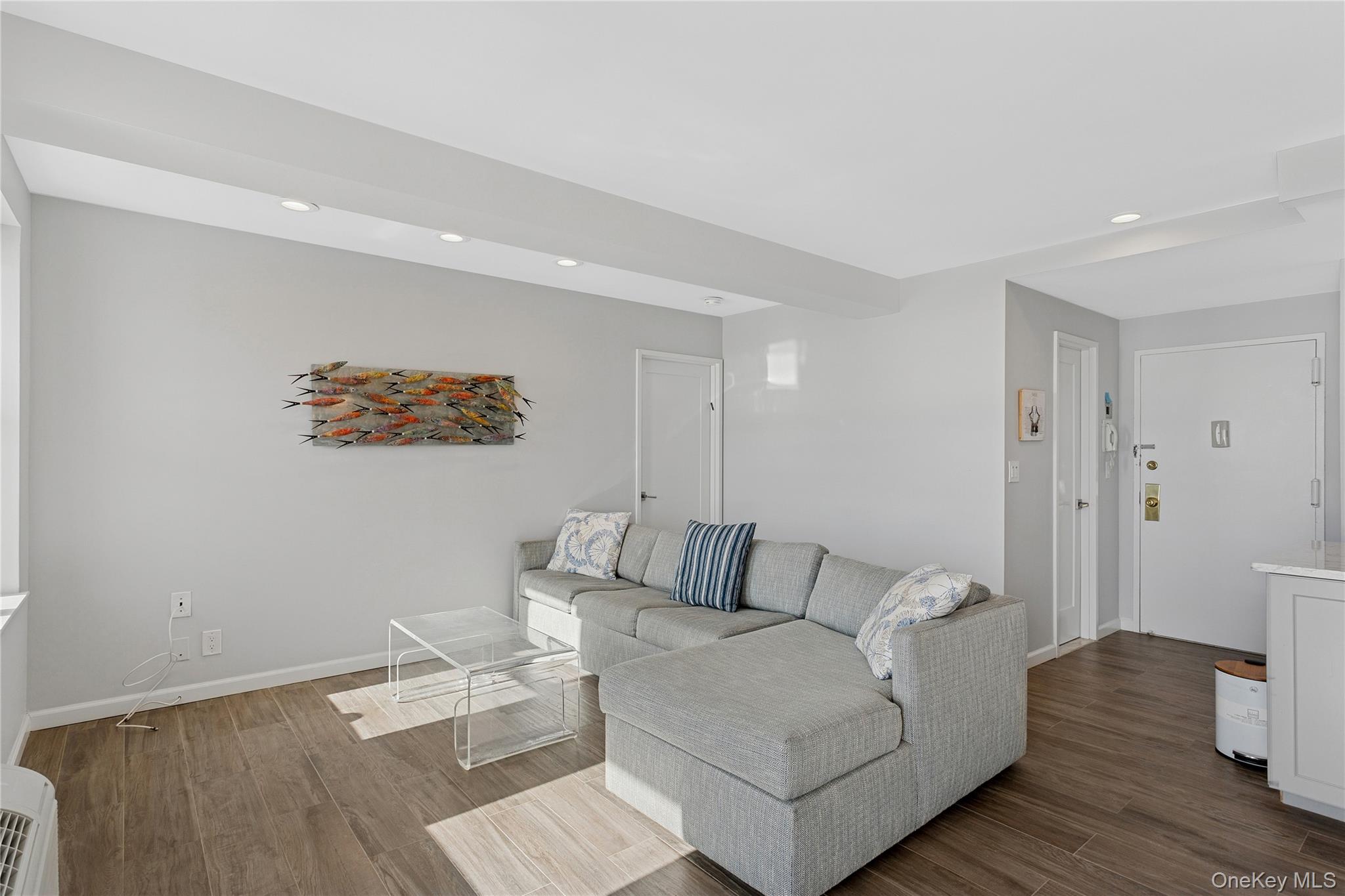 2 Richmond Road, Unit 3A Lido Beach, NY 11561 - Photo 3 of 33 a living room with furniture and wooden floor