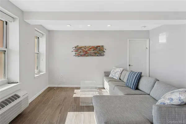 a living room with furniture and windows