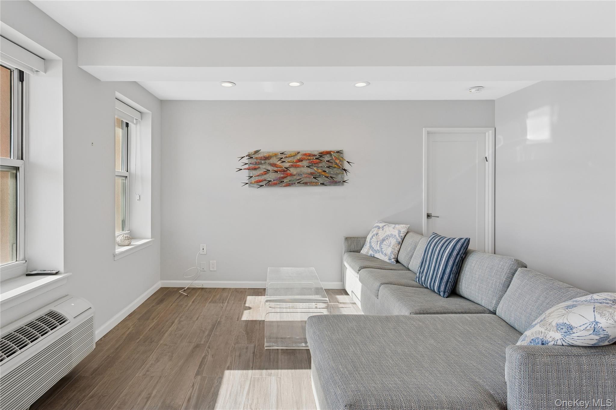 2 Richmond Road, Unit 3A Lido Beach, NY 11561 - Photo 4 of 33 a living room with furniture and a window