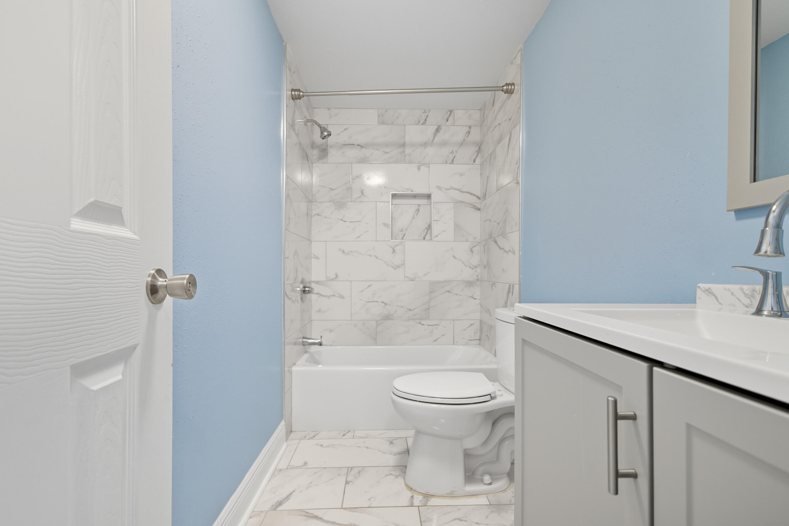 714 East Picasso Road DeFuniak Springs, FL 32433 - Photo 13 of 25 a bathroom with a granite countertop sink a toilet and shower