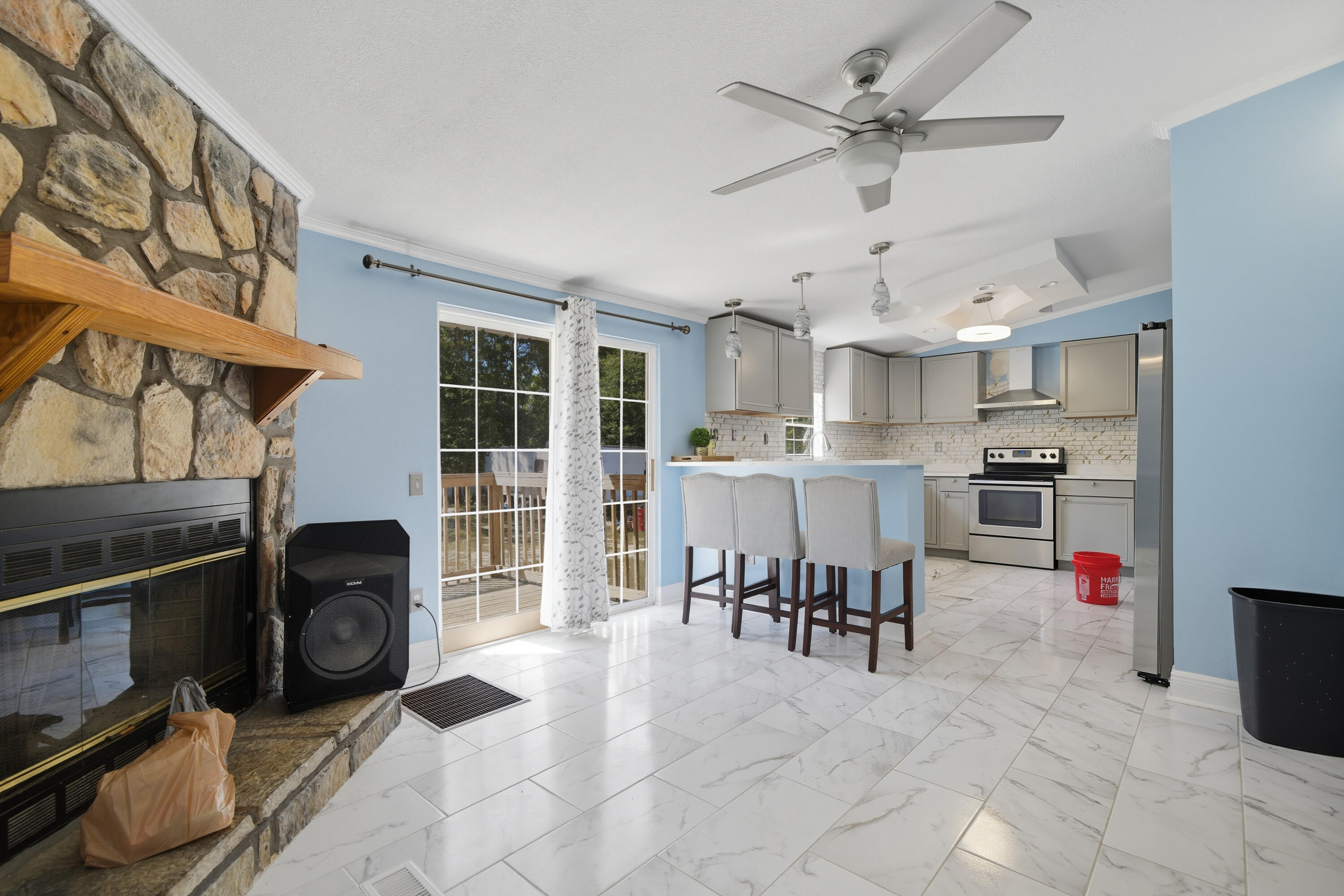 714 East Picasso Road DeFuniak Springs, FL 32433 - Photo 5 of 25 a living room with stainless steel appliances furniture and a kitchen view