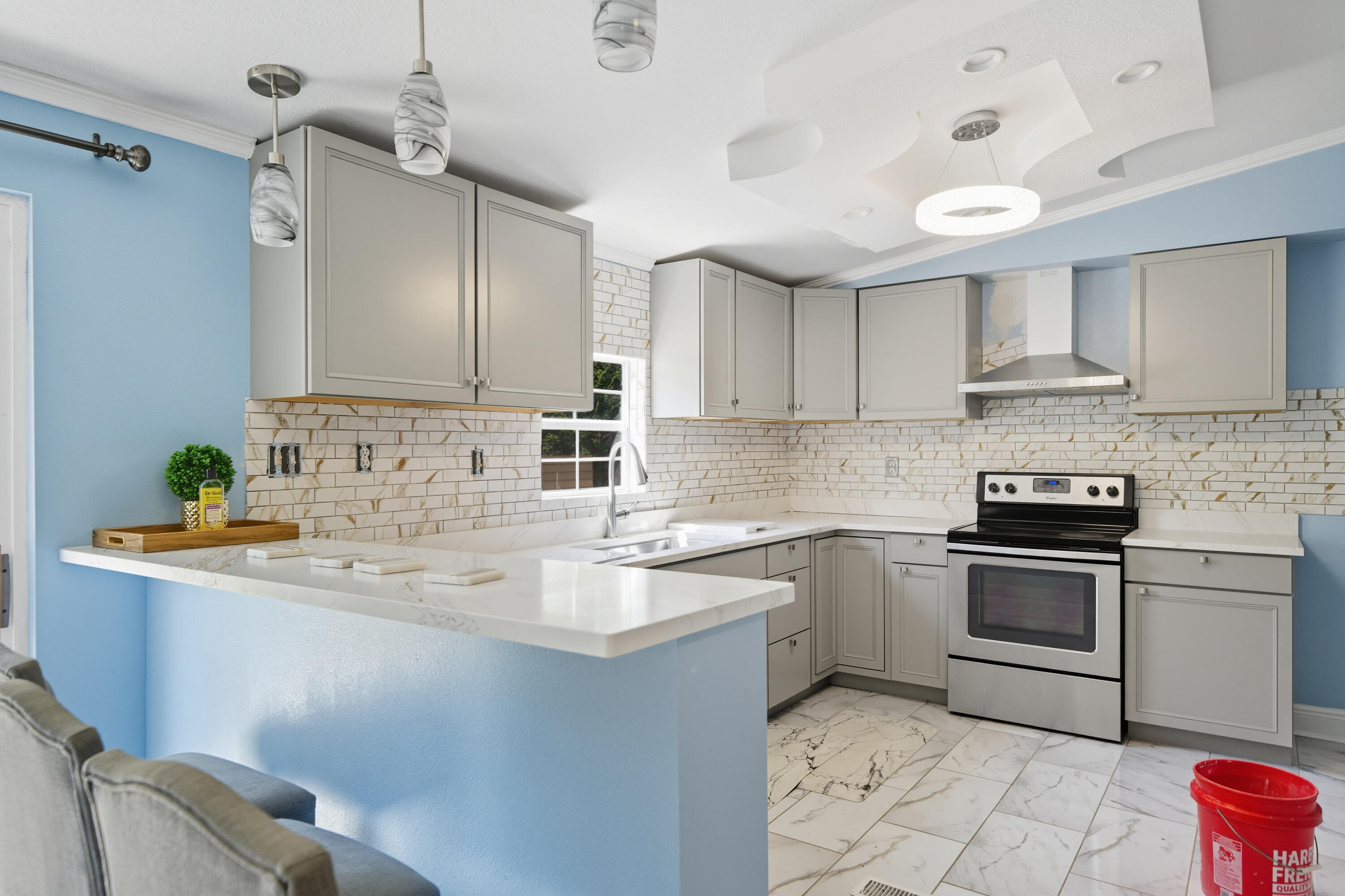 714 East Picasso Road DeFuniak Springs, FL 32433 - Photo 8 of 25 a kitchen with stainless steel appliances granite countertop a sink and cabinets