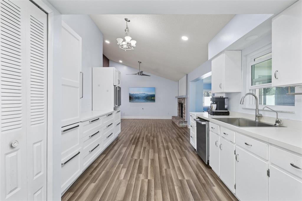 3613 Coppertree Circle Brandon, FL 33511 - Photo 11 of 51 a kitchen with granite countertop white cabinets and white appliances