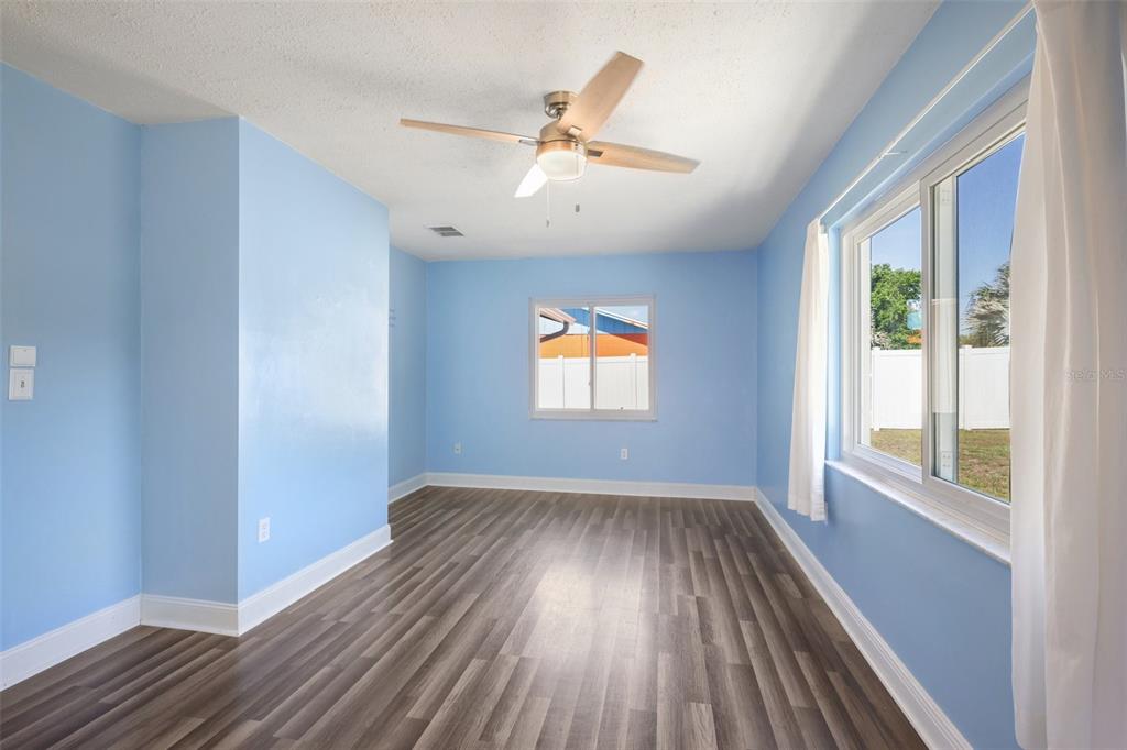 3613 Coppertree Circle Brandon, FL 33511 - Photo 14 of 51 wooden floor in an empty room with a window