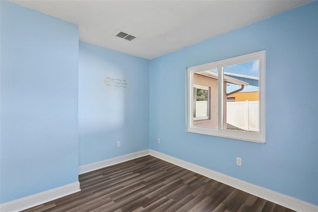 3613 Coppertree Circle Brandon, FL 33511 - Photo 15 of 51 a view of an empty room with wooden floor and a window