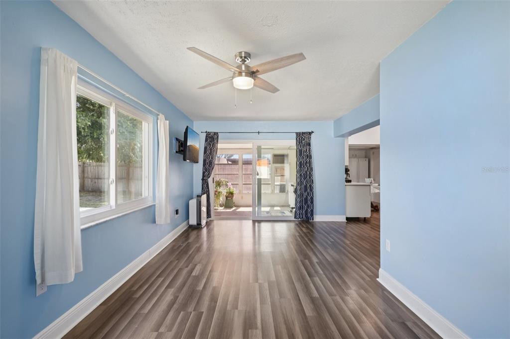 3613 Coppertree Circle Brandon, FL 33511 - Photo 16 of 51 a view of a livingroom with wooden floor and a ceiling fan
