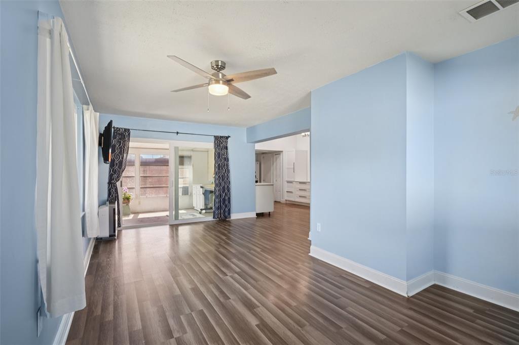 3613 Coppertree Circle Brandon, FL 33511 - Photo 17 of 51 a view of a livingroom with wooden floor and a ceiling fan