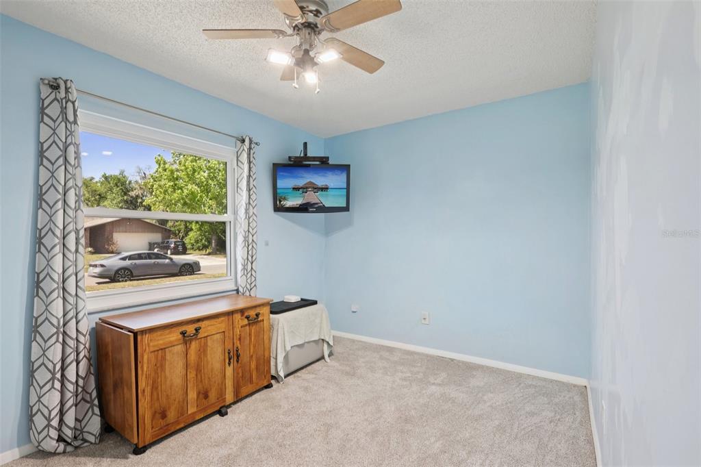 3613 Coppertree Circle Brandon, FL 33511 - Photo 18 of 51 a living room with furniture and a flat screen tv