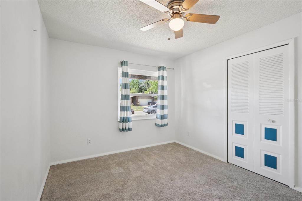 3613 Coppertree Circle Brandon, FL 33511 - Photo 30 of 51 an empty room with windows and fan