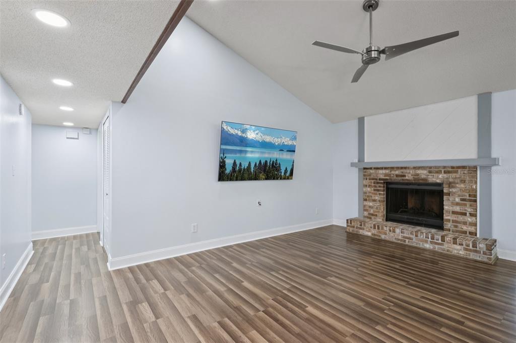 3613 Coppertree Circle Brandon, FL 33511 - Photo 3 of 51 a view of an empty room with wooden floor fireplace and a window