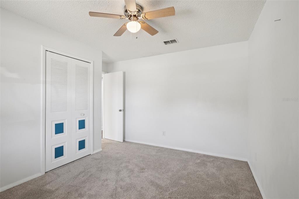 3613 Coppertree Circle Brandon, FL 33511 - Photo 32 of 51 an empty room with windows and fan