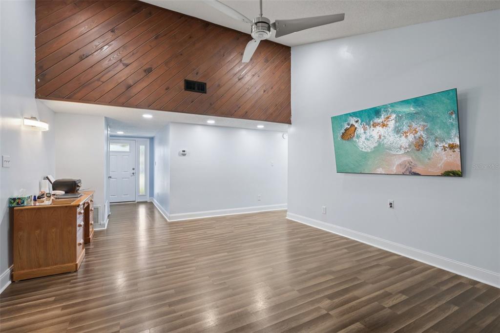 3613 Coppertree Circle Brandon, FL 33511 - Photo 4 of 51 an empty room with wooden floor and windows