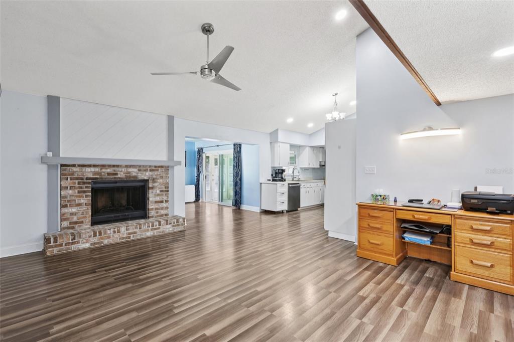 3613 Coppertree Circle Brandon, FL 33511 - Photo 6 of 51 a living room with stainless steel appliances kitchen island furniture and a fireplace