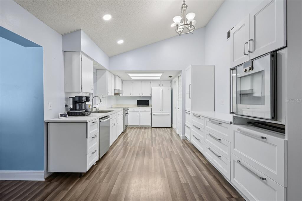 3613 Coppertree Circle Brandon, FL 33511 - Photo 8 of 51 a large white kitchen with cabinets
