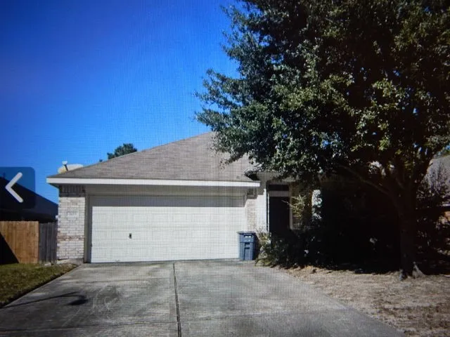 a front view of a house with a garage