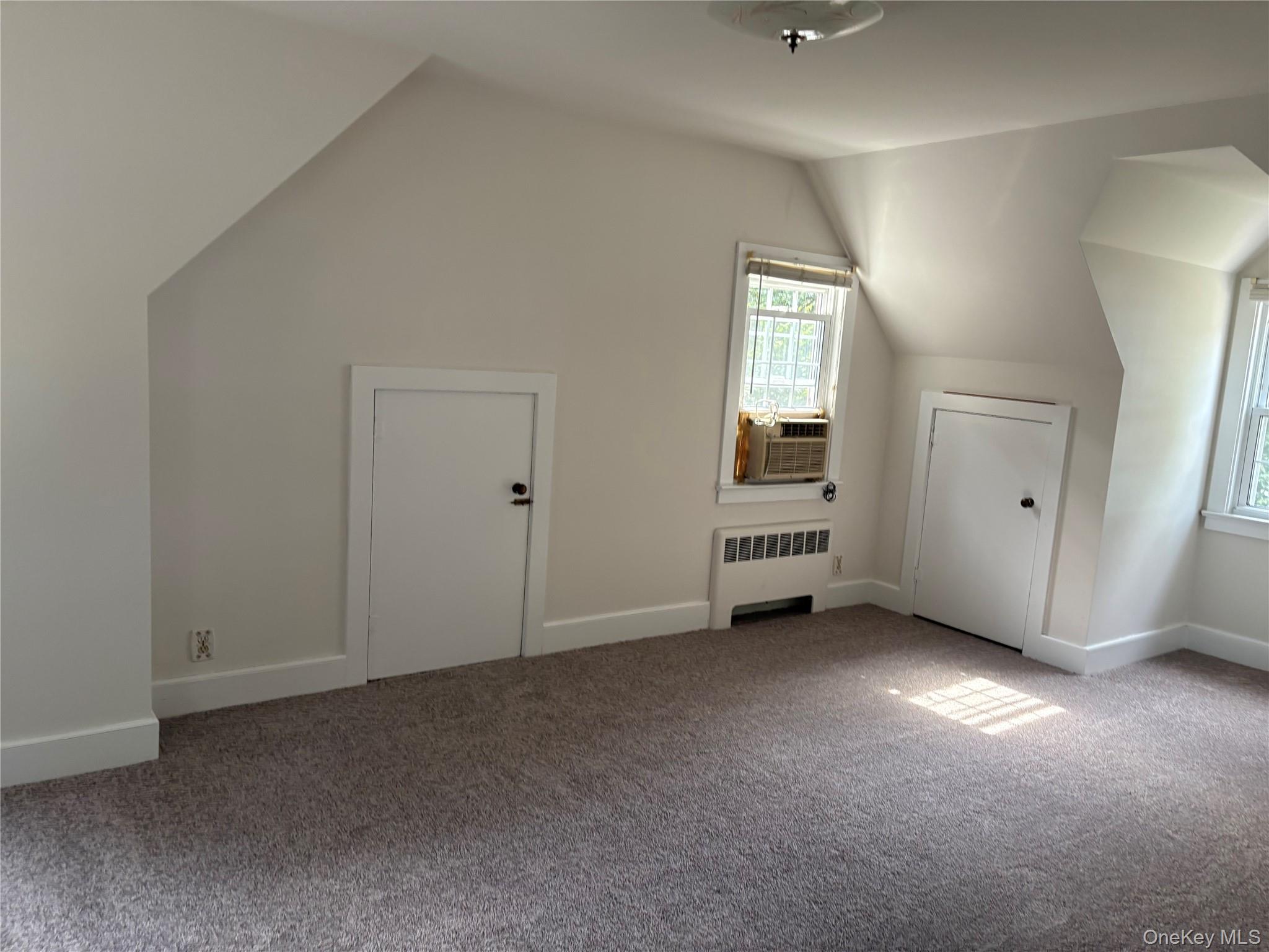 660 Wheeler Hill Road Wappingers Falls, NY 12590 - Photo 14 of 32 an empty room with windows and cabinet