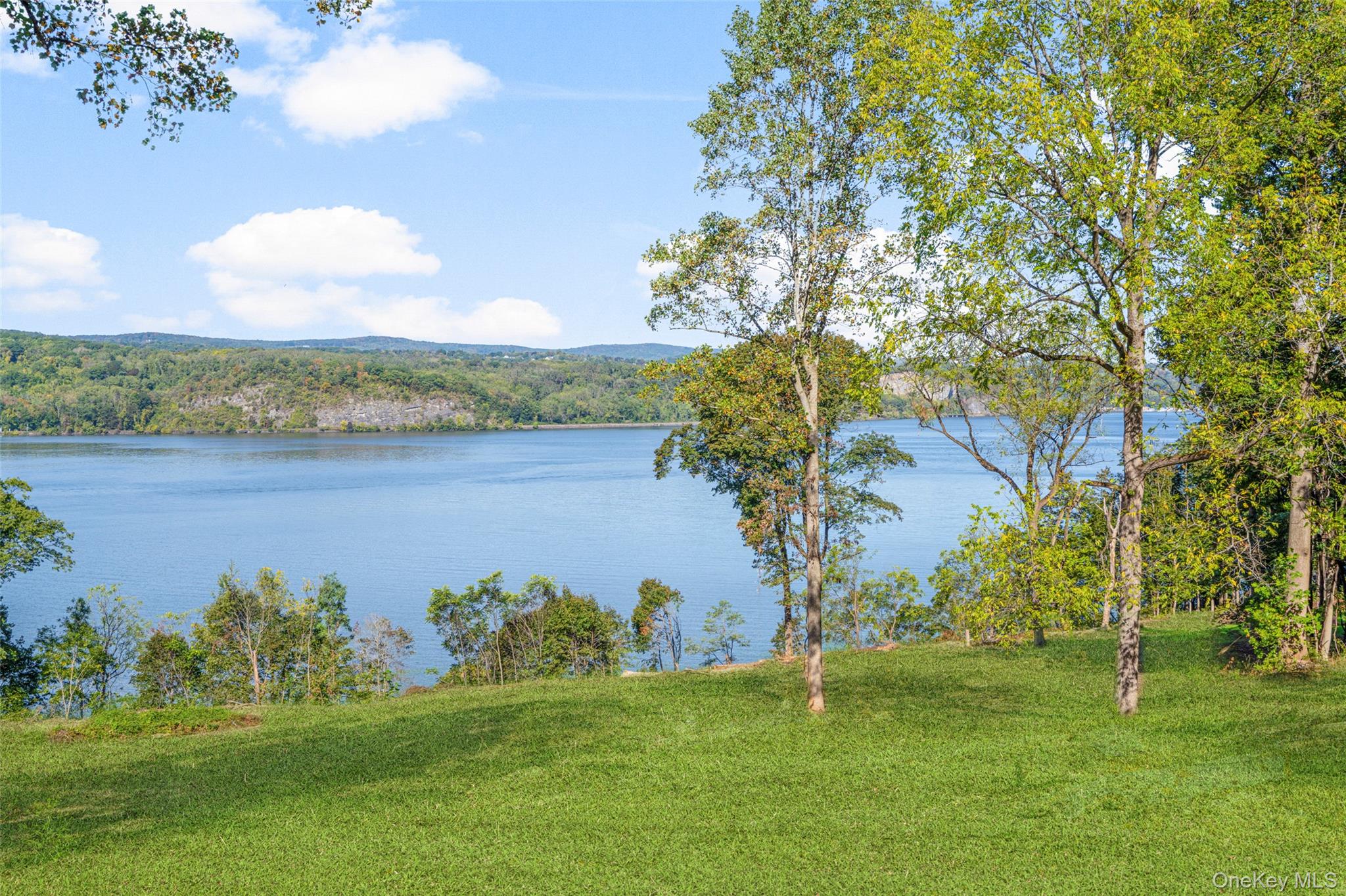 660 Wheeler Hill Road Wappingers Falls, NY 12590 - Photo 20 of 32 a view of a lake with a yard