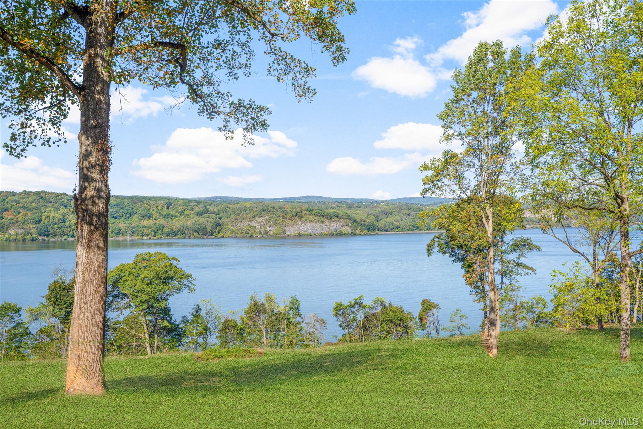 660 Wheeler Hill Road Wappingers Falls, NY 12590 - Photo 2 of 32 a view of a lake with a yard