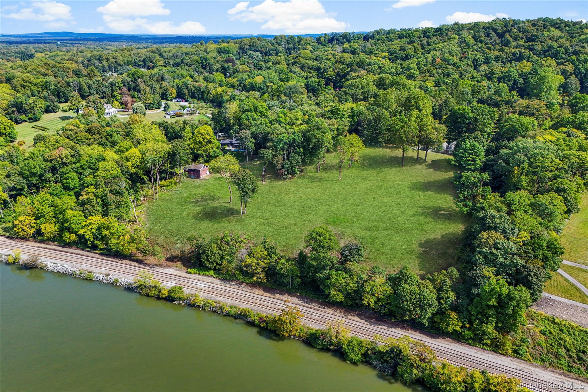 660 Wheeler Hill Road Wappingers Falls, NY 12590 - Photo 29 of 32 a view of a garden with a lake