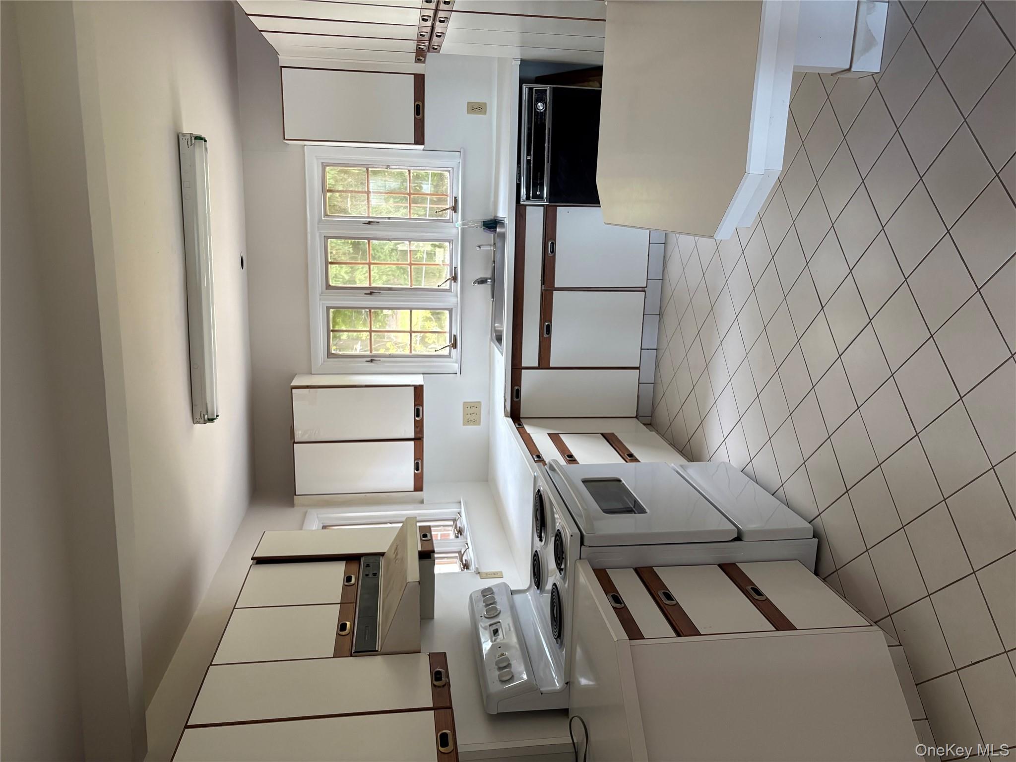 660 Wheeler Hill Road Wappingers Falls, NY 12590 - Photo 9 of 32 a kitchen with stainless steel appliances granite countertop white cabinets a sink and a stove