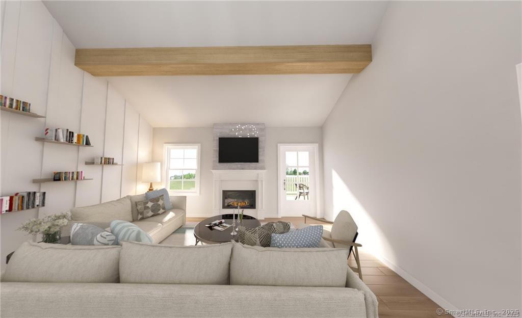 0 Country Court, Unit 134 Berlin, CT 06037 - Photo 5 of 7 a living room with furniture and a flat screen tv